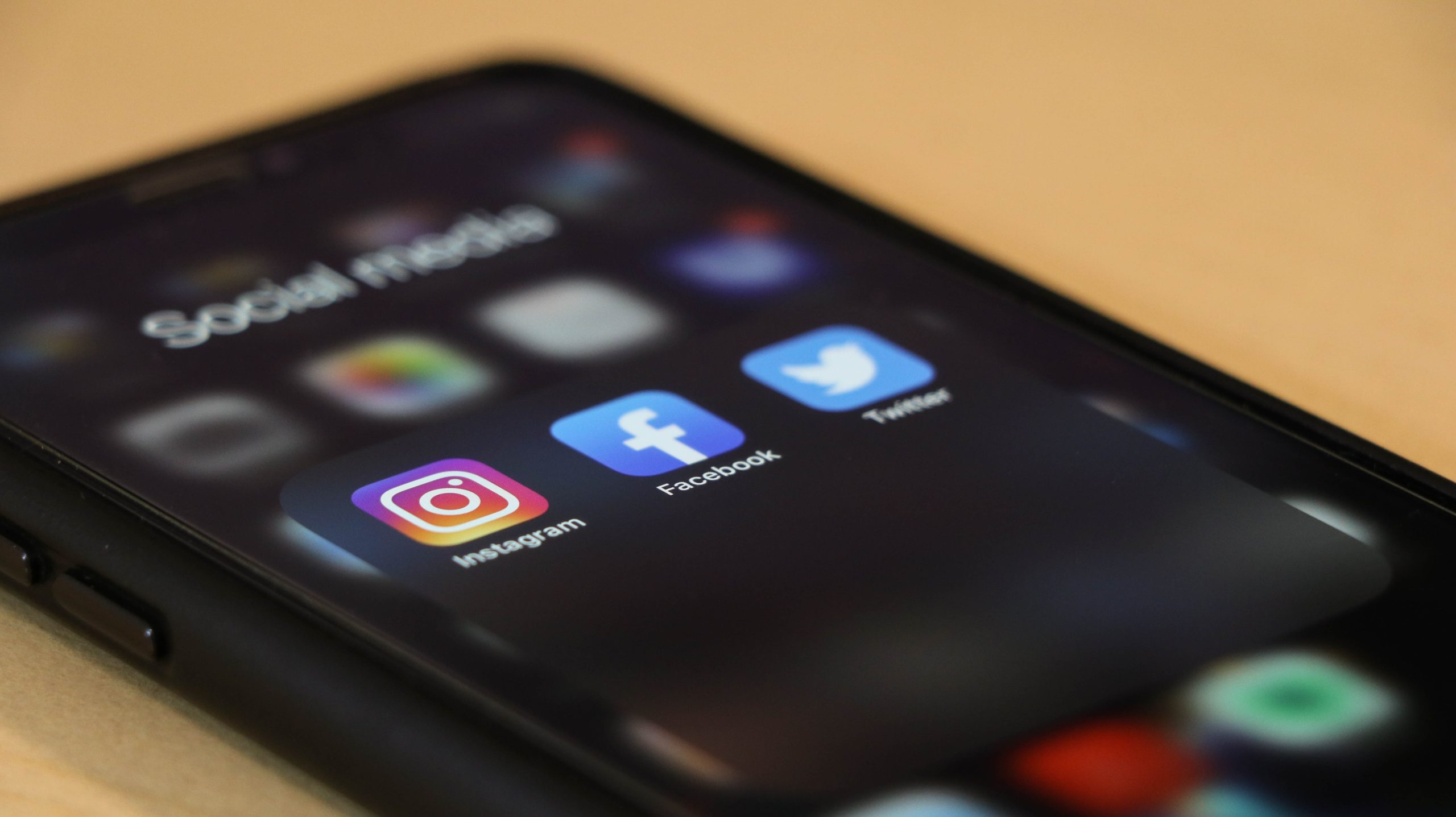 dole777-EQSPI11rf68-unsplash iPhone screen showing social media apps